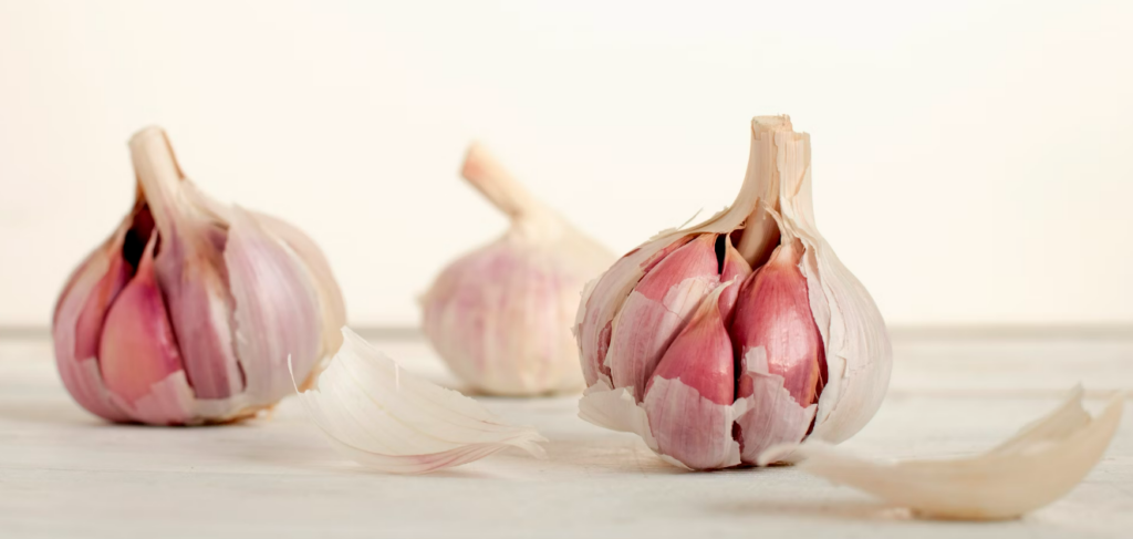 A peeled garlic revealing the inner cloves.