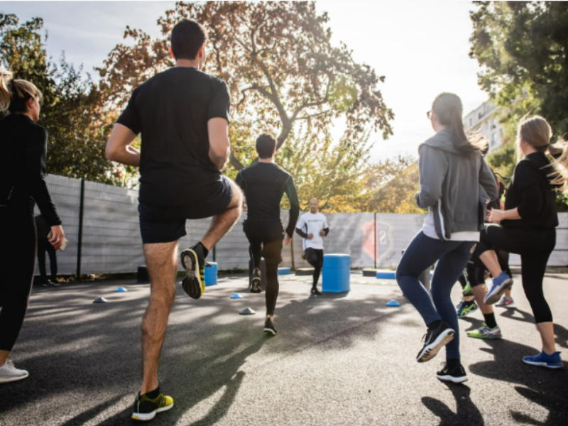 A group of people exercising together to burn calories.