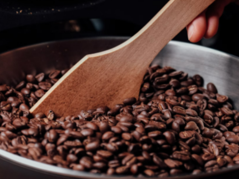 Toasting black lentils in a pot.